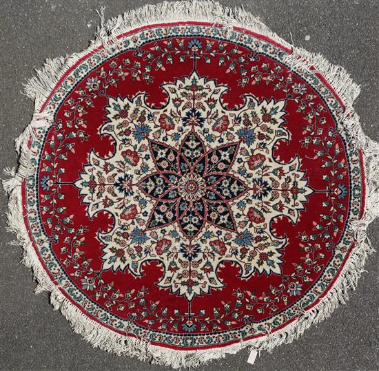 A circular Persian rug, diameter 5ft 9in.